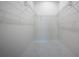 Walk-in closet with marble floors and wire shelving, offering ample storage space at 9594 Se 61St Ter, Belleview, FL 34420