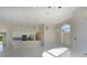 Bright, open floor plan showcases marble floors, kitchen with stainless steel appliances, and an arched window at 9594 Se 61St Ter, Belleview, FL 34420