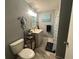 Charming bathroom with a tiled floor, stylish decor, a toilet, a shower/tub, and vanity at 1008 Se 26Th St, Ocala, FL 34471