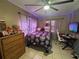 Bedroom featuring a queen bed, natural light, a dresser, and a desk with a chair at 1008 Se 26Th St, Ocala, FL 34471
