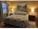 A serene bedroom with a queen-sized bed, soft lighting, and beach-themed decorations at 1008 Se 26Th St, Ocala, FL 34471