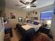 Cozy bedroom with ceiling fan, natural light, and comfortable furnishings at 1008 Se 26Th St, Ocala, FL 34471