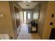 Entryway with tile flooring, a decorative front door, and a small table at 1008 Se 26Th St, Ocala, FL 34471