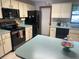 Kitchen view with dated countertops and appliances at 1008 Se 26Th St, Ocala, FL 34471
