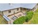 Aerial view of the house and backyard including a patio, a fire pit, and landscaping at 1010 Sw 26Th St, Ocala, FL 34471