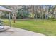 Large backyard featuring a grassy lawn and mature trees in a park-like setting at 1010 Sw 26Th St, Ocala, FL 34471