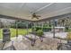 View of the backyard patio including metal furniture, outdoor grill, and a fire pit at 1010 Sw 26Th St, Ocala, FL 34471