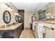 Elegant bathroom featuring dual sinks, granite countertops, and updated fixtures at 1010 Sw 26Th St, Ocala, FL 34471