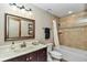 Bathroom featuring a vanity with a white sink, a toilet, and a shower over tub with tile surround at 1010 Sw 26Th St, Ocala, FL 34471