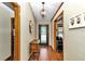 Inviting foyer features a hardwood floor, attractive light fixture and decorative door glass at 1010 Sw 26Th St, Ocala, FL 34471