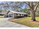 The house offers an attached two-car garage and a long driveway at 1010 Sw 26Th St, Ocala, FL 34471