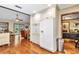 Kitchen area featuring white cabinetry, modern appliances, and hardwood floors at 1010 Sw 26Th St, Ocala, FL 34471