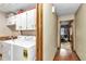 Bright laundry room with white cabinets and full-size washer and dryer at 1010 Sw 26Th St, Ocala, FL 34471