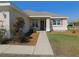 Cozy front porch of a single Gathering home with nice landscaping at 13100 Se 93Rd Terrace Rd, Summerfield, FL 34491