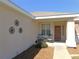 Charming front porch seating area, perfect for relaxing outdoors at 13100 Se 93Rd Terrace Rd, Summerfield, FL 34491