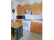 Kitchen featuring a large window over the sink, plenty of counter space, and ample cabinet storage at 13100 Se 93Rd Terrace Rd, Summerfield, FL 34491