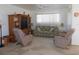 Comfortable living room with plush seating and a built-in entertainment center, perfect for relaxing at 13100 Se 93Rd Terrace Rd, Summerfield, FL 34491