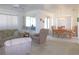 Open concept living room flowing into the dining area, creating a spacious and inviting atmosphere at 13100 Se 93Rd Terrace Rd, Summerfield, FL 34491