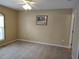 A neutral bedroom boasts ample natural light with neutral carpeting and a ceiling fan at 1546 Sw 153Rd Sw Ct, Ocala, FL 34481