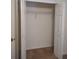 An empty, carpeted closet with white trim and doors for simple storage and organization at 1546 Sw 153Rd Sw Ct, Ocala, FL 34481