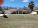 Charming single-story home with well-maintained lawn, mature landscaping, and welcoming front porch at 1546 Sw 153Rd Sw Ct, Ocala, FL 34481