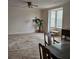 Dining room with natural light, classic furniture, and neutral carpet at 162 Riggings Way, Clermont, FL 34711