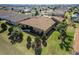 Aerial view of the home showing a well-maintained yard, landscaping, and mature trees at 16276 Sw 14Th Ct, Ocala, FL 34473