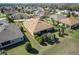 Aerial view of the home featuring a large backyard with mature trees and a well-kept lawn at 16276 Sw 14Th Ct, Ocala, FL 34473