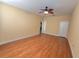 Open bedroom with hardwood floors and a ceiling fan at 16276 Sw 14Th Ct, Ocala, FL 34473