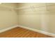 Empty closet with wood flooring and wire shelving for organized storage at 16276 Sw 14Th Ct, Ocala, FL 34473