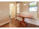 Bright dining area with a built-in bench, storage cabinets, and wood table at 16276 Sw 14Th Ct, Ocala, FL 34473