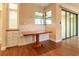 Bright dining area with a built-in bench, storage cabinets, and wood table with a sliding door at 16276 Sw 14Th Ct, Ocala, FL 34473