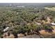 Aerial view of multiple lakefront properties surrounded by trees at 17153 Se 79Th Street Rd, Ocklawaha, FL 32179