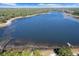 Aerial view of the lake and a dock near the lakefront property at 17153 Se 79Th Street Rd, Ocklawaha, FL 32179