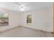 Neutral bedroom with two windows offering lots of light and views of the trees outside at 17153 Se 79Th Street Rd, Ocklawaha, FL 32179