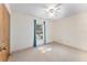 Bedroom featuring neutral carpeting and natural light from a window at 17153 Se 79Th Street Rd, Ocklawaha, FL 32179