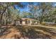 Charming single-story home with a well-maintained front lawn and mature trees offering shade at 17153 Se 79Th Street Rd, Ocklawaha, FL 32179