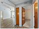 Bright hallway leading to the open layout living room, adjacent to a bedroom at 17153 Se 79Th Street Rd, Ocklawaha, FL 32179