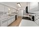 Well-lit kitchen featuring white cabinets, stainless steel appliances, and modern finishes at 17153 Se 79Th Street Rd, Ocklawaha, FL 32179