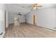 Bright living room featuring wood floors, ceiling fans, and sliding glass doors at 17153 Se 79Th Street Rd, Ocklawaha, FL 32179