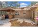 Outdoor kitchen area with built-in countertop and sink, ready for entertaining in the backyard at 17153 Se 79Th Street Rd, Ocklawaha, FL 32179