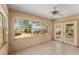 Cozy sunroom with lots of windows offering views of the water and manicured yard at 17153 Se 79Th Street Rd, Ocklawaha, FL 32179