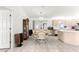 Open dining area featuring a chandelier, and a view into the kitchen at 17421 Se 107Th Ct, Summerfield, FL 34491