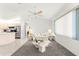 Bright living room with neutral tones and a view of the kitchen at 17421 Se 107Th Ct, Summerfield, FL 34491