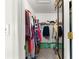 Walk-in closet with organized storage, featuring ample hanging space and shelving for optimal organization at 17421 Se 107Th Ct, Summerfield, FL 34491