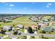 Overhead shot showcasing the home's location in a golf community with meticulous landscaping at 17818 Se 120Th Ct, Summerfield, FL 34491