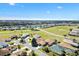 Scenic aerial shot highlighting the home's location in a residential golf community with beautiful views at 17818 Se 120Th Ct, Summerfield, FL 34491