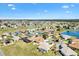 Panoramic aerial view of residential community close to a golf course and sparkling lakes at 17818 Se 120Th Ct, Summerfield, FL 34491