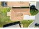 Overhead shot of the home's roof, landscaping, and driveway with street and surrounding residences at 17818 Se 120Th Ct, Summerfield, FL 34491