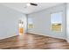 Well-lit bedroom featuring two large windows and wood-look flooring at 17818 Se 120Th Ct, Summerfield, FL 34491